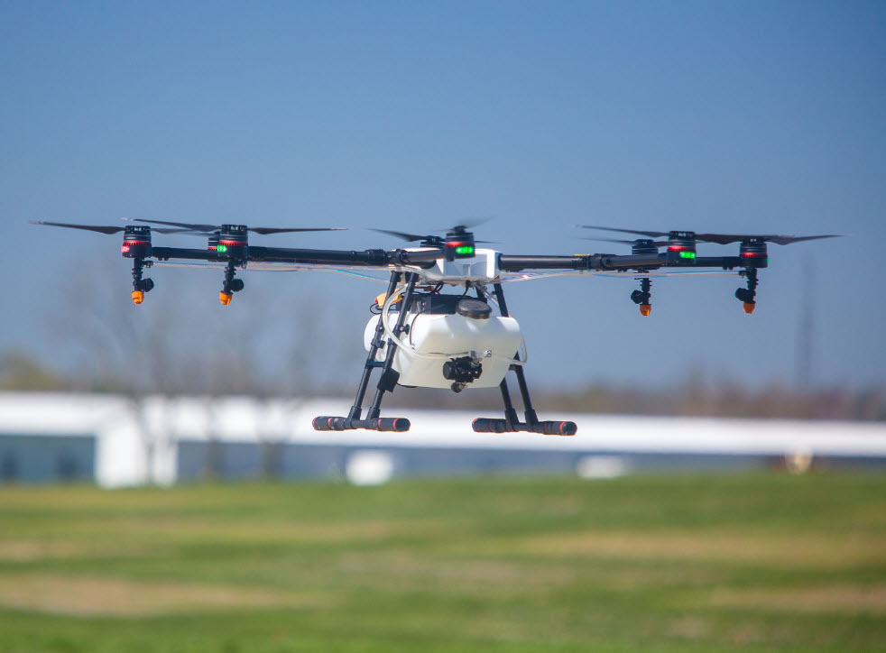 Drone flying over field